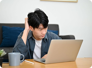 Stressed man working on laptop