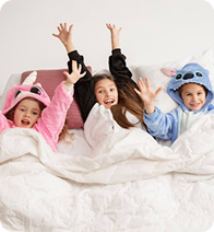 Happy kids on bed